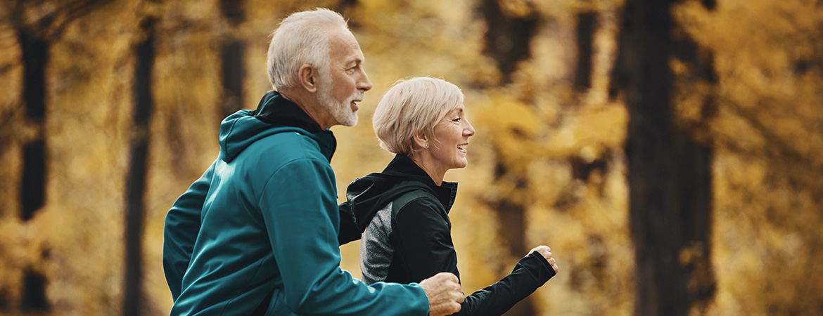 Older couple jogging together